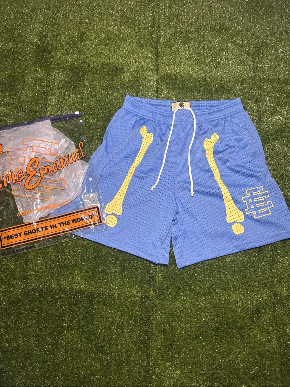 Eric Emanuel Light Blue Mesh Shorts with Yellow Bone Graphics